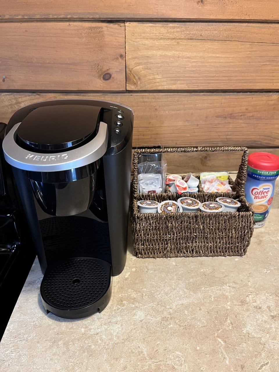 keurig coffee maker with coffee, creamer and sugar provided