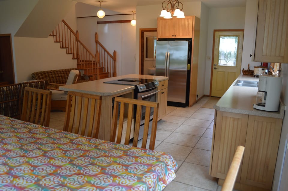 Great room on the 1st floor including kitchen and dining area of the Lake House