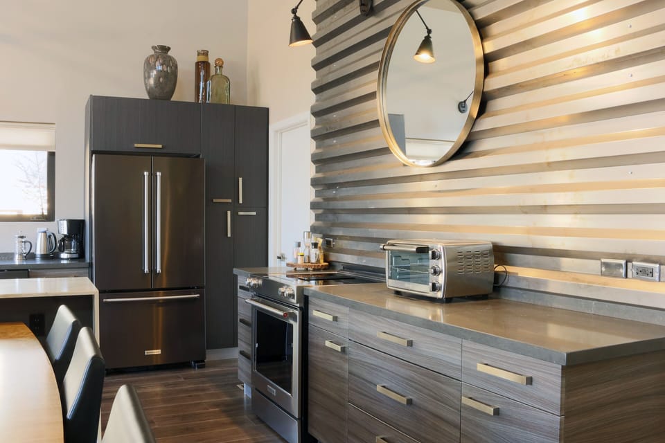 Modern kitchen with plenty of cooking ware and utensils