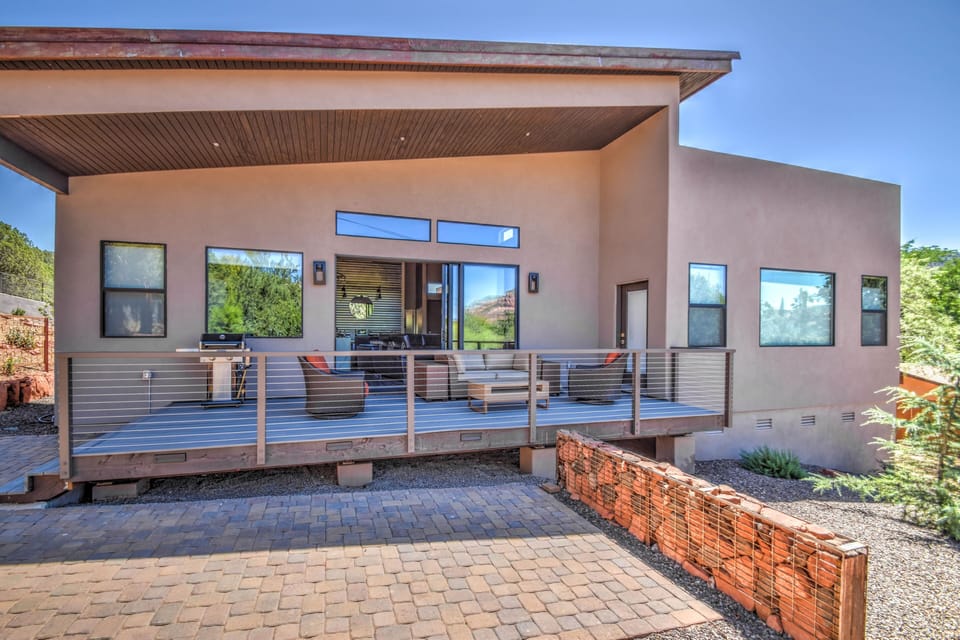 Entertainment area with comfortable seating and gas grill