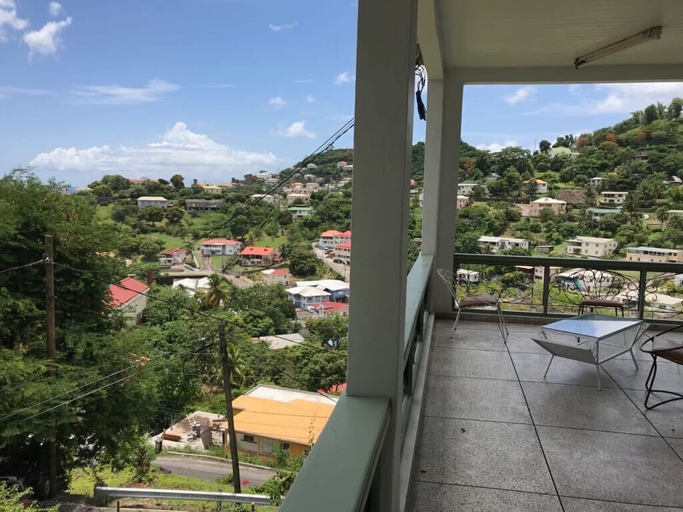 Looking across valley above city from balcony.
