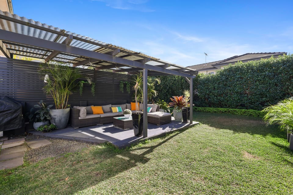 Backyard with BBQ and undercover outdoor entertaining area.