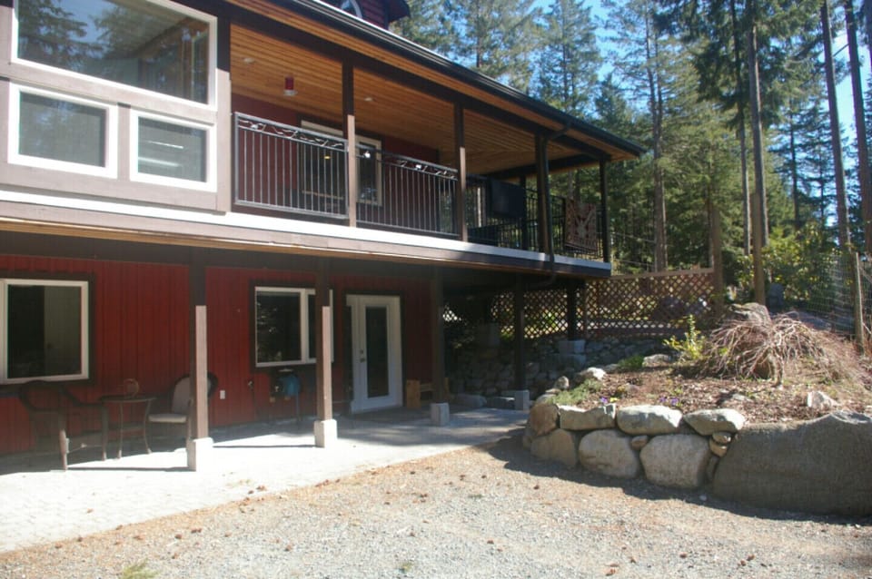 Walkout basement suite with parking right outside the door. Covered patio with bistro table , barbeque and a nice view.