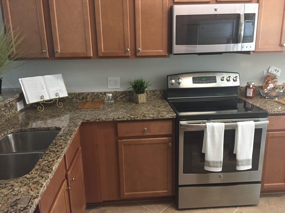 Stainless NEW granite with coffee maker, toaster ,blender, pots, dishes, spices