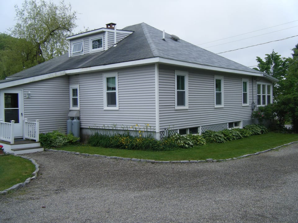 Back and side, driveway w/plenty of parking