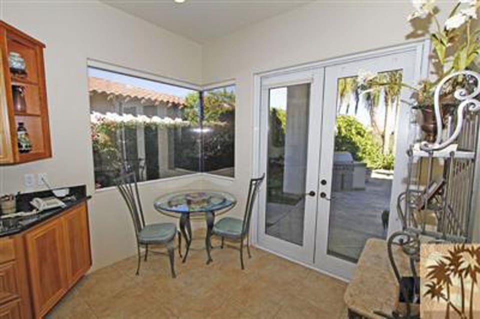 Dining Nook in Kitchen overlooking barbecue, pool and golf course