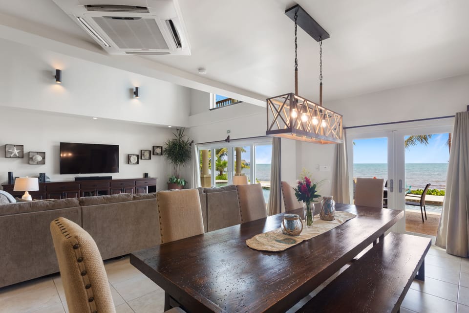 Large dining table seats 10; easy access to indoor and outdoor kitchens