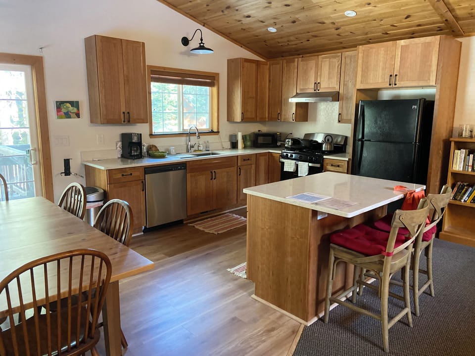 Updated modern open kitchen with gas range and dishwasher