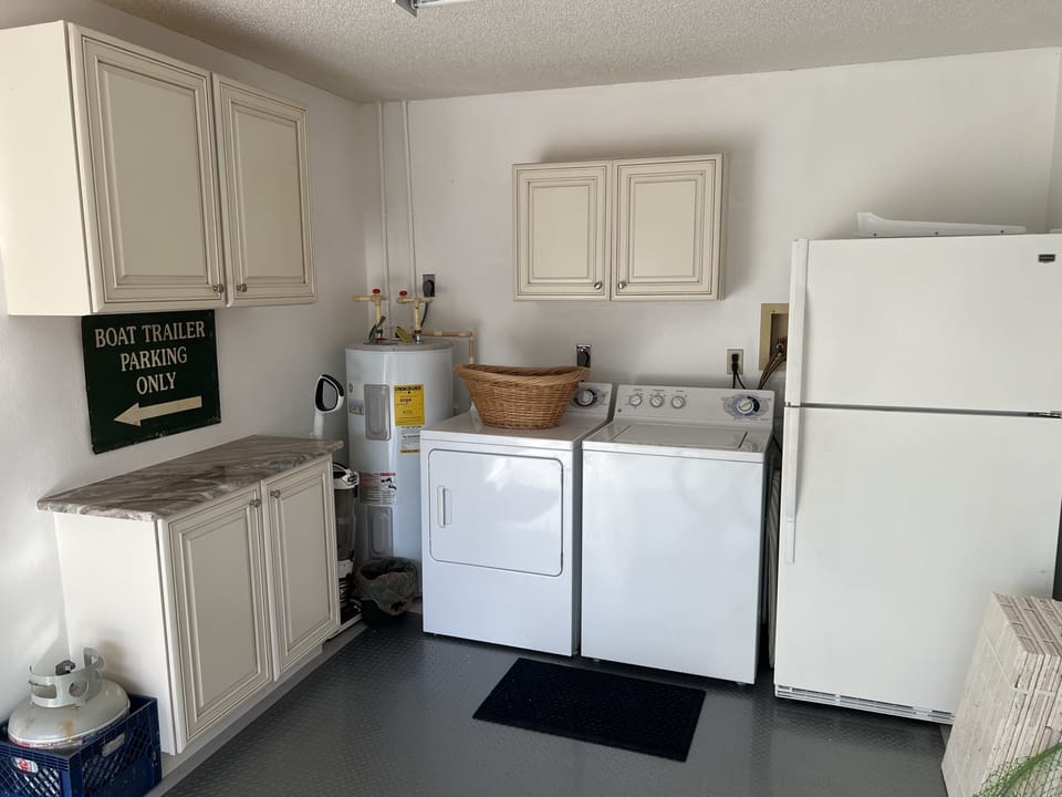 Washer dryer and extra fridge in garage