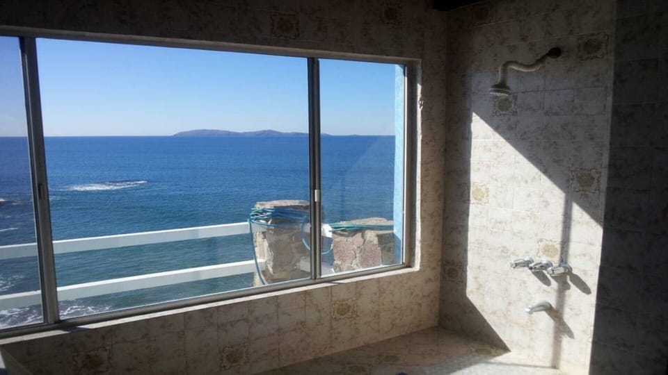Master bath  toooo big to fill with hot water and shower. Have a look  views!