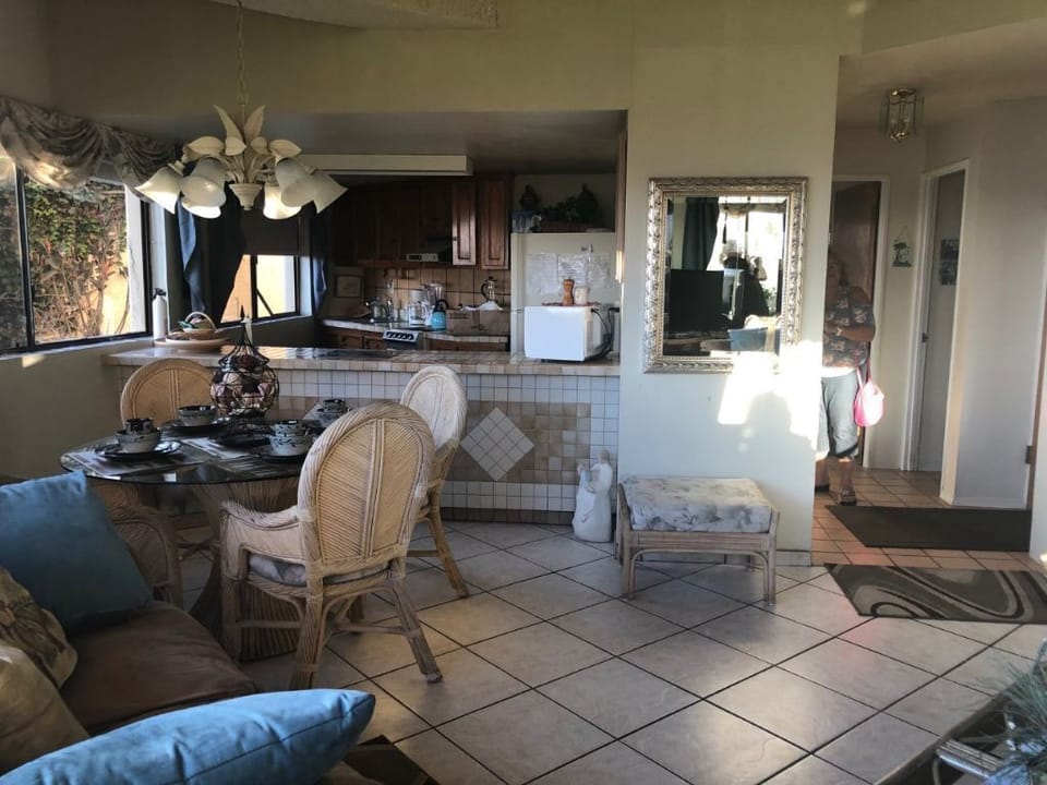 Living and dining. Condo in front of beach   Light and bright  hear    waves