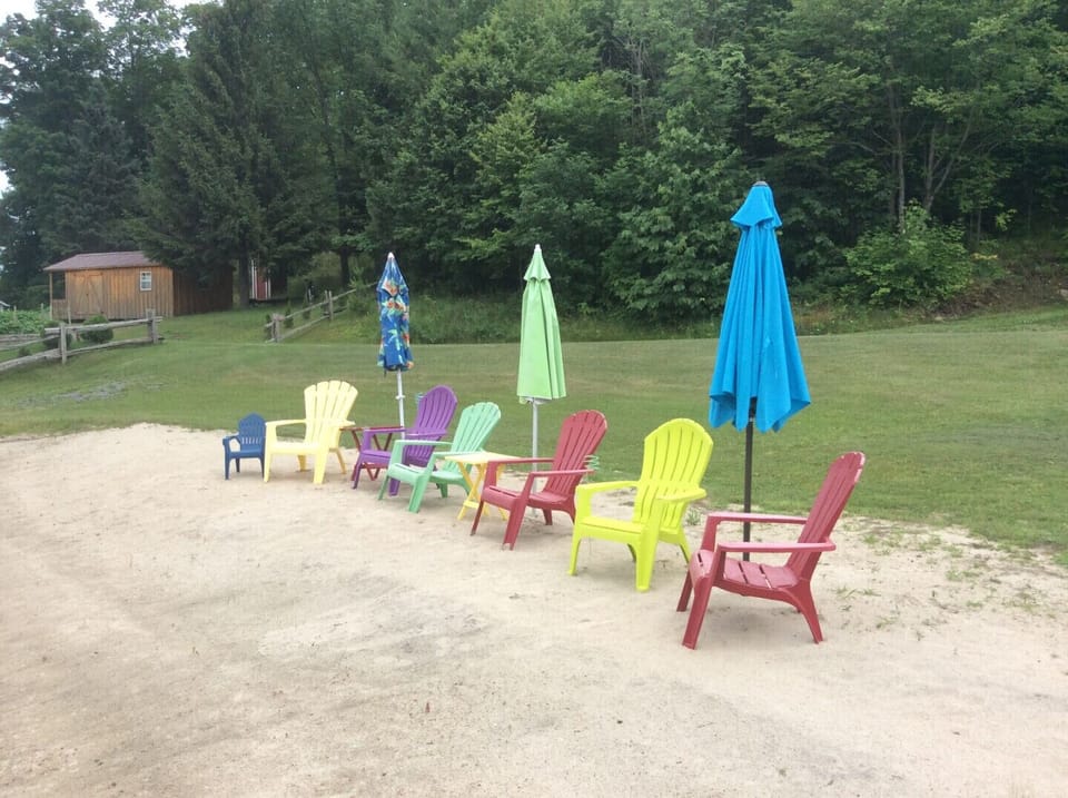 Beach with chairs and umbrellas.