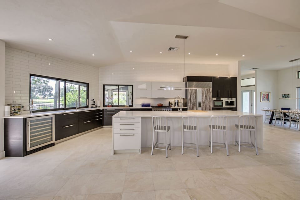 Kitchen with Panoramic Golf Course and Water Views
