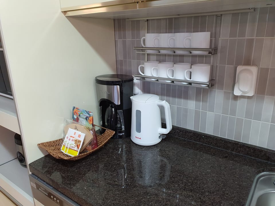 Drip coffee maker, electric kettle, coffee cups.  Coffee/filters not replenished