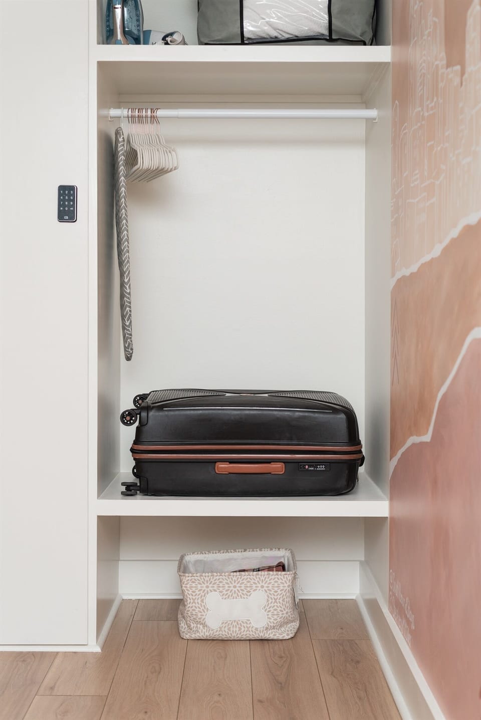 Closet space with built in luggage shelf.