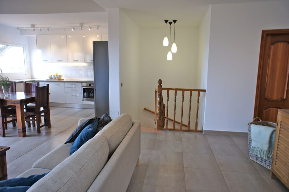 Stairway to 3 bedrooms has permanent child gate