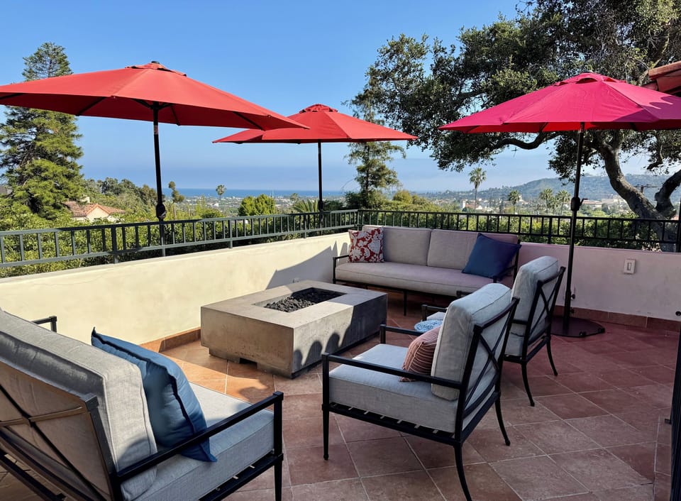 Large outdoor patio with ocean view; fire pit; dining table seating 10 people