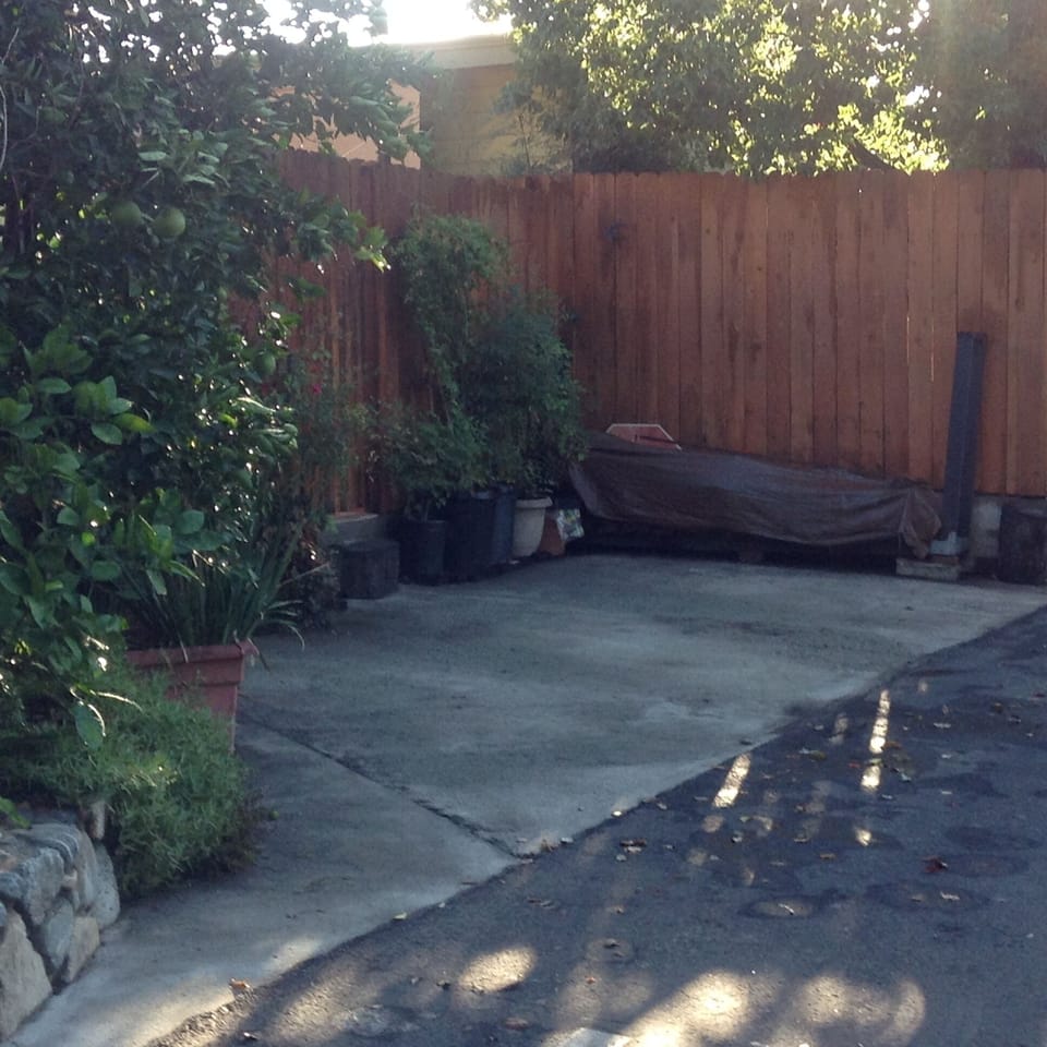 Off street parking for one vehicle with fenced inner garden/patio.