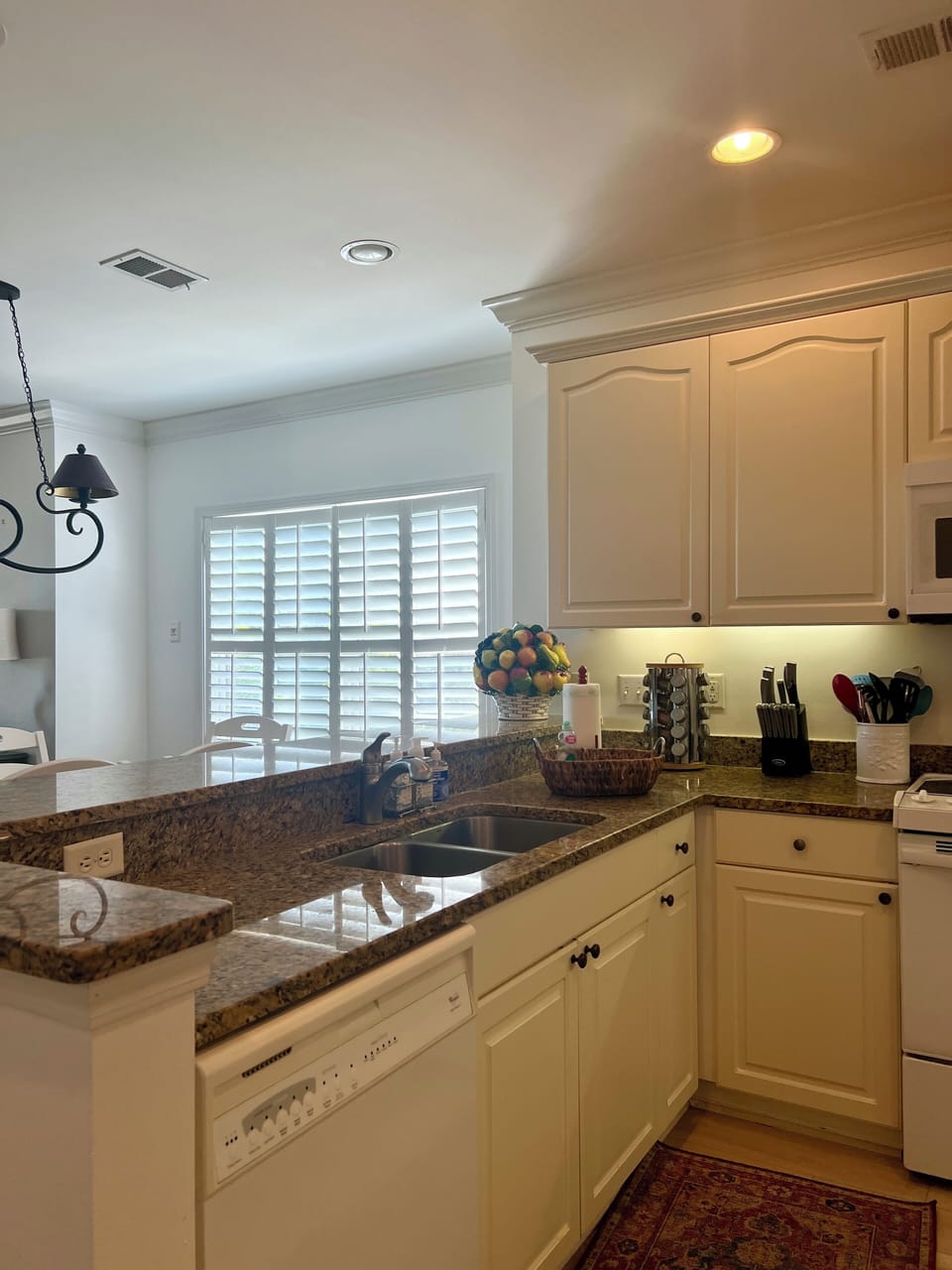 Sink and breakfast bar in open kitchen