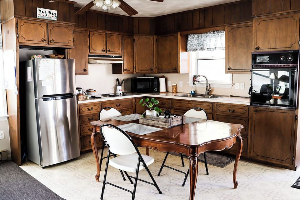 Farm fresh eggs and milk in fridge, homemade bread and cereal on the counter.