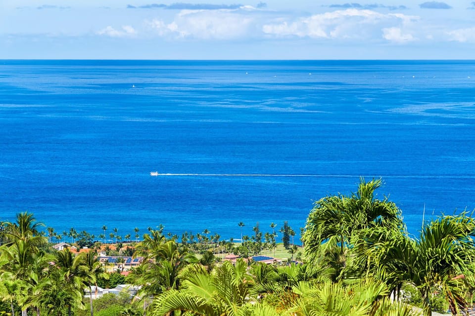 Ocean view from the primary bedroom overlooking the Kona coastline.
