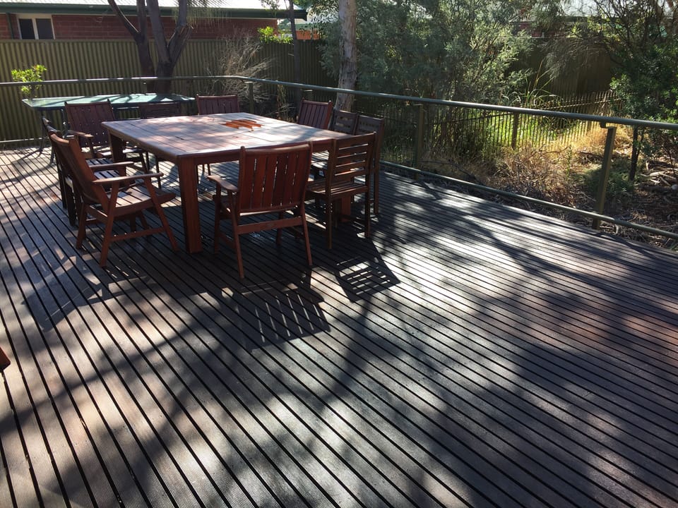 Large decking area with outdoor eating area. 