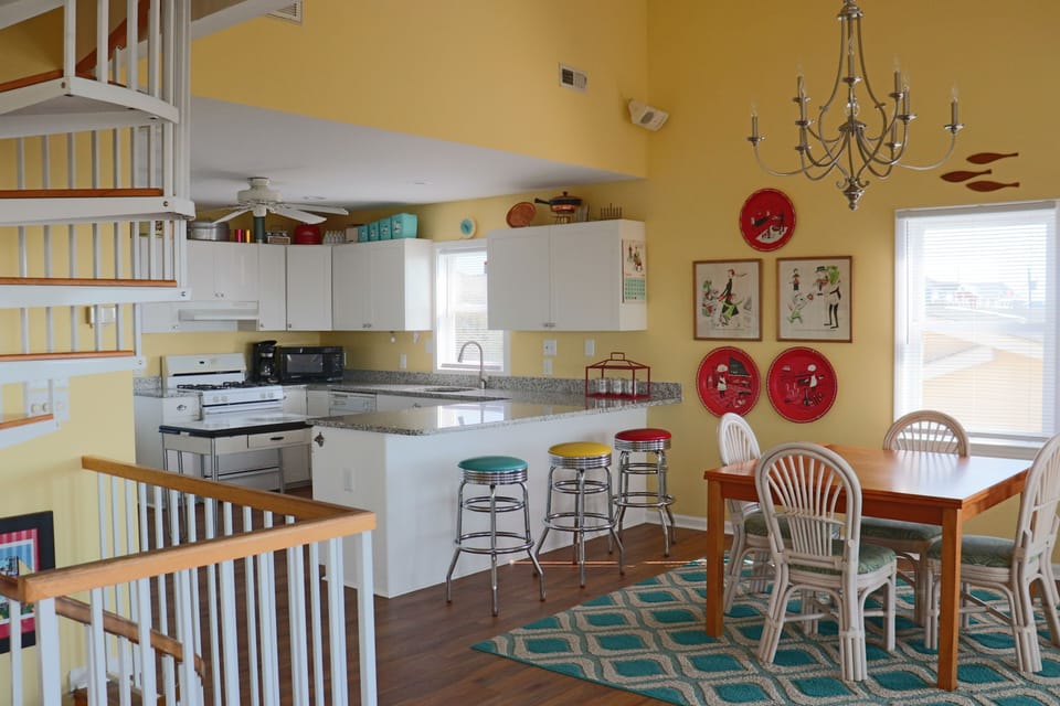 Your bright, cheerful kitchen flows seamlessly into the dining area, creating the perfect space for morning coffee and family meals together.