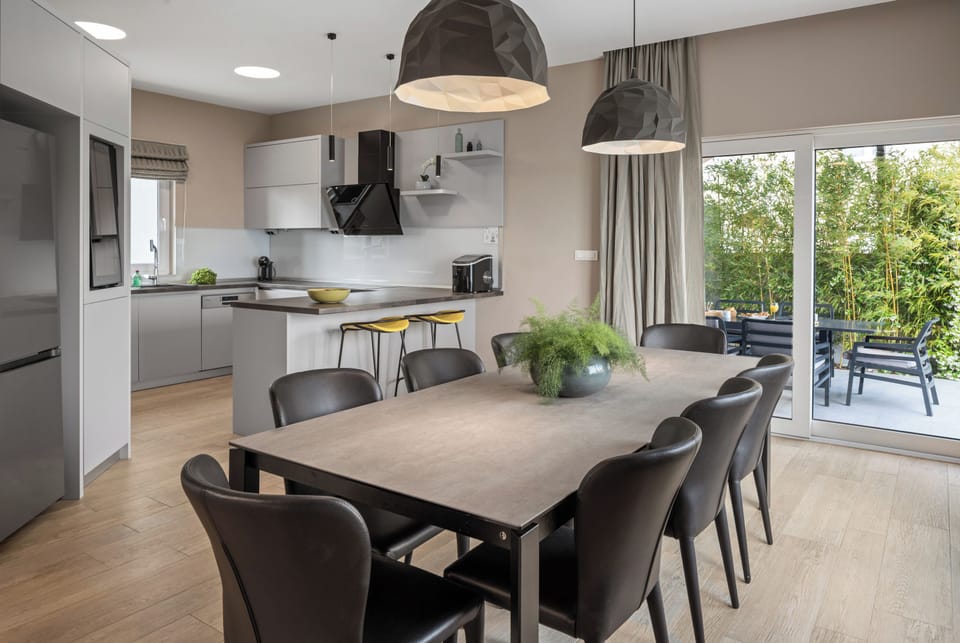 Comfortable dining area for 8 people with an exit to the outdoor dining area