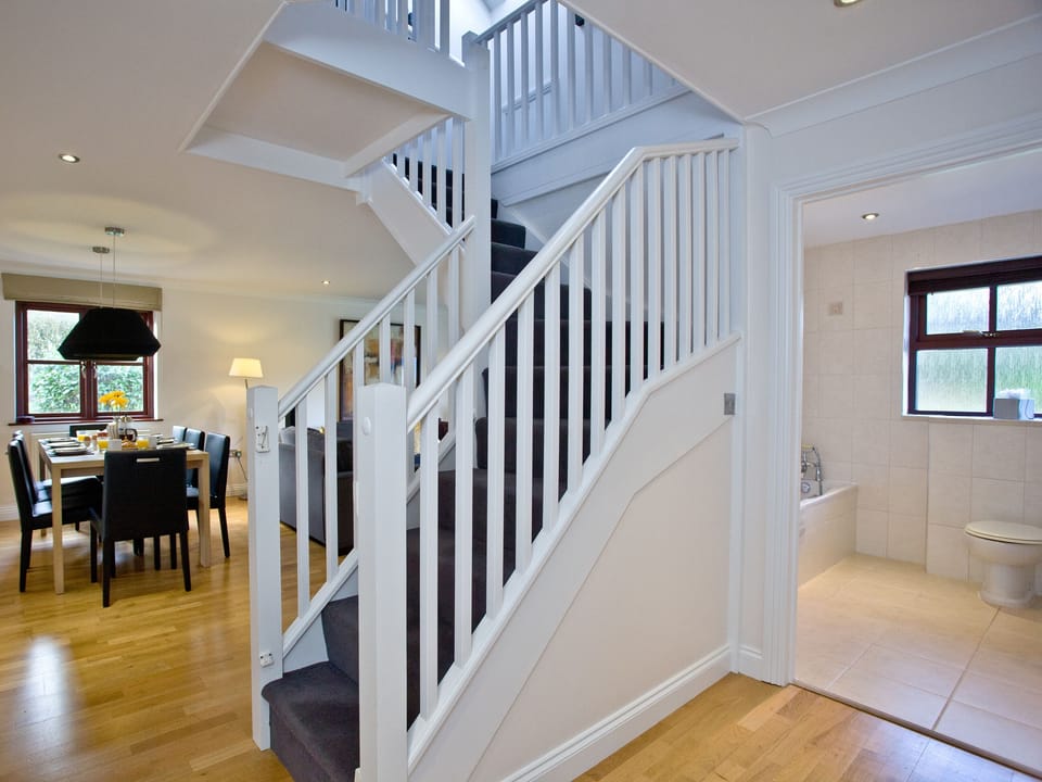Spacious open hallway with stairs to first floor | Holly - Woodland Retreat, Wadebridge