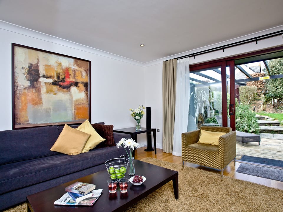 Lovely living area with sliding doors to the garden | Holly - Woodland Retreat, Wadebridge