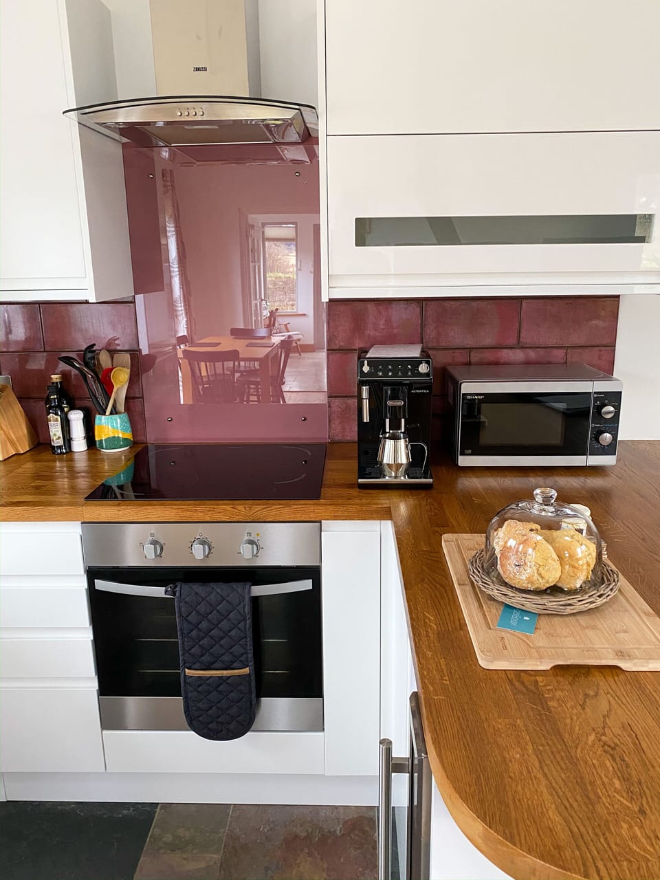 View into kitchen with bean to cup coffee machine 