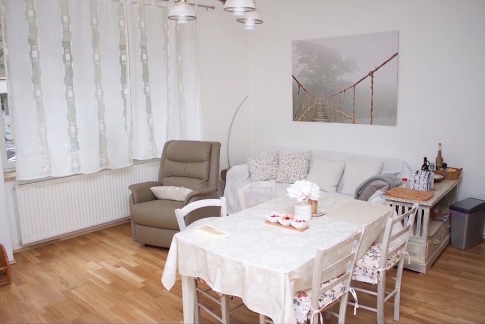 A big and bright living room looking on the street. 