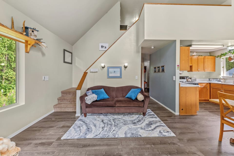 Living room, couch, chairs, wood-burning stove