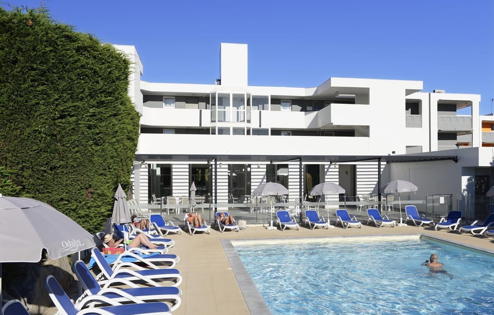 Lounge by the pool in the sunshine.