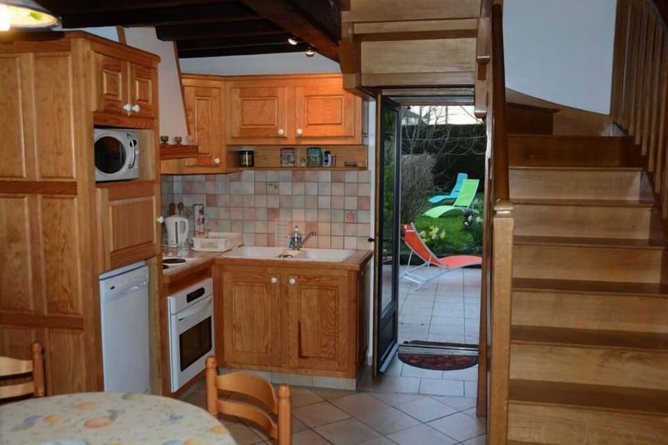 The kitchen area opens onto the terrace and garden