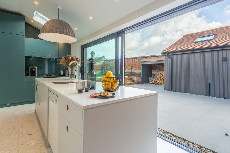 Ground floor: Kitchen's sliding doors to the courtyard garden