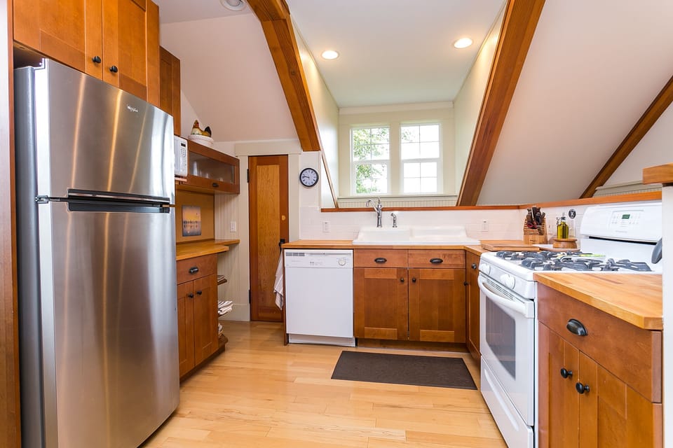 Kitchen with dishwasher, gas range/oven, and pantry closet