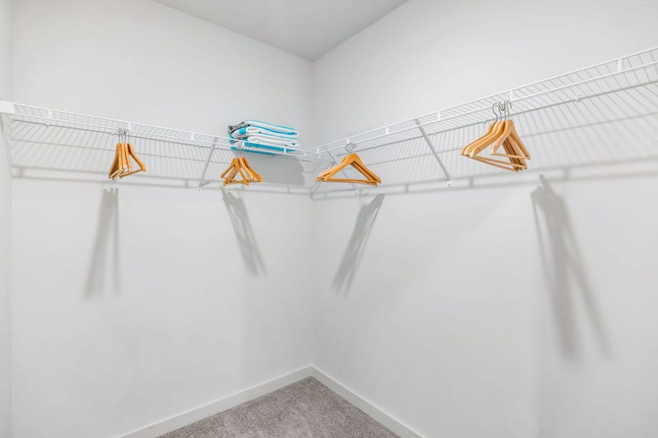 Spacious Closet with Ironing Supplies - Short Term Corporate Rentals - Spectacular Suites