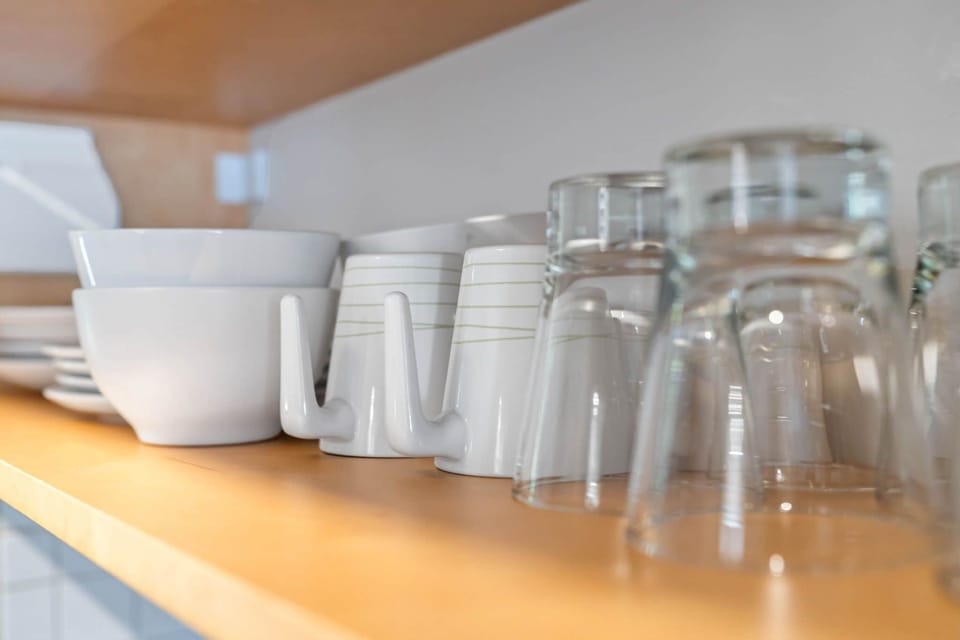 BCA Mugs - Temporary Accommodations - Chic Premium Studios on 25th