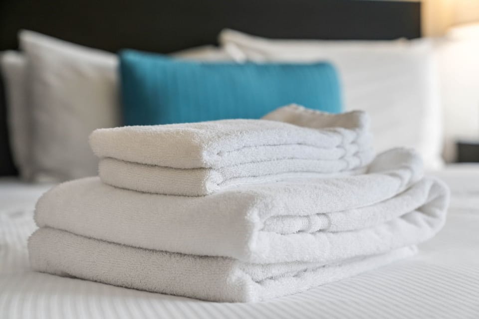 Fresh Linens and Furnished Living Space - Corporate Apartments - Studios On 25th