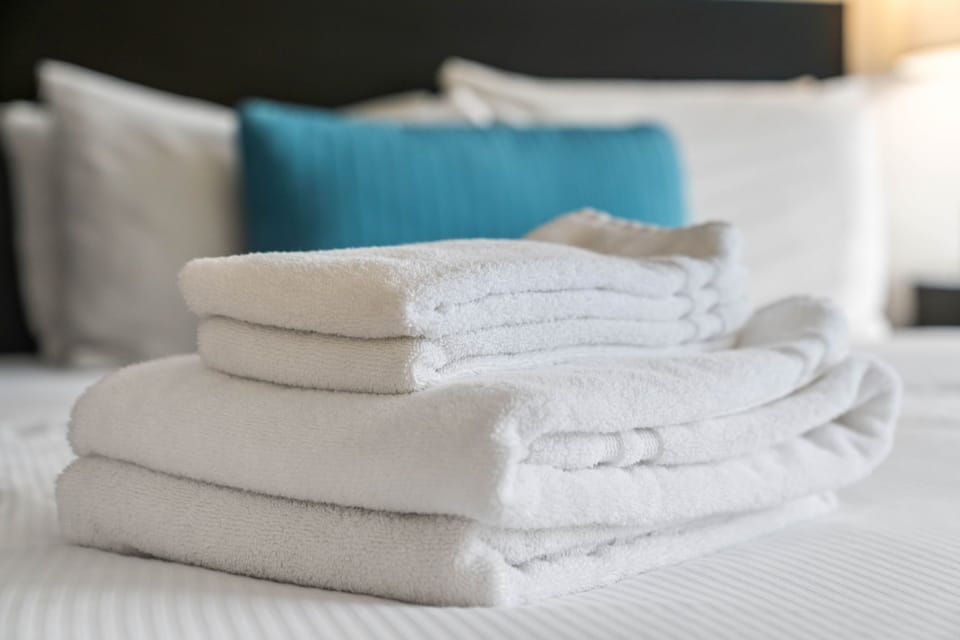 Fresh Linens and Furnished Living Space - Corporate Apartments - Studios On 25th