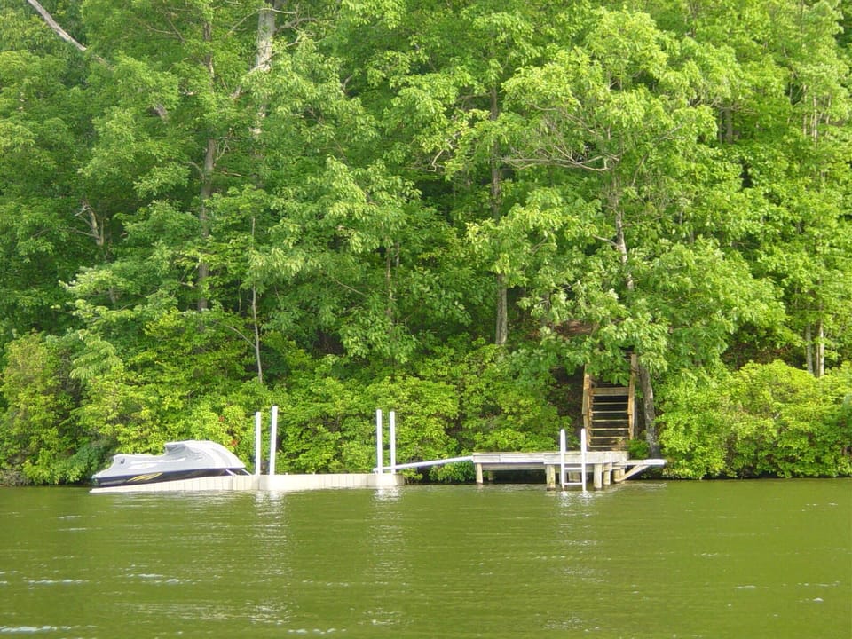 Boat dock has room to park 2 boats.  Water is ~10 feet deep at end of dock.