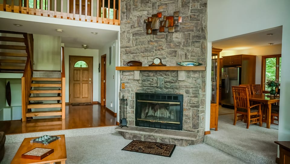 Living room open to dining room and upstairs walkway