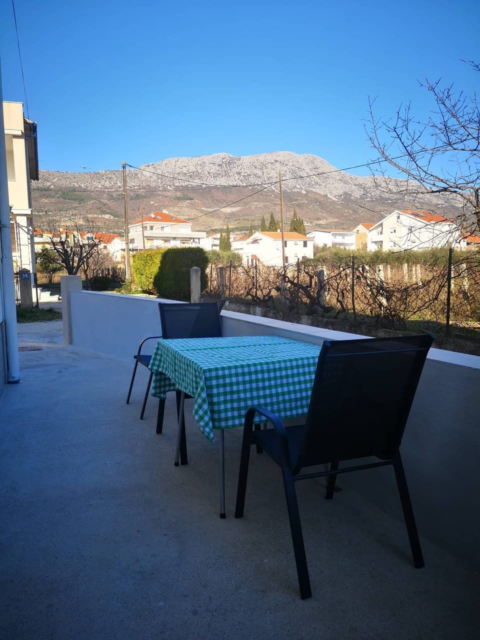 Seating place in a front of the apartment with a mountain view.