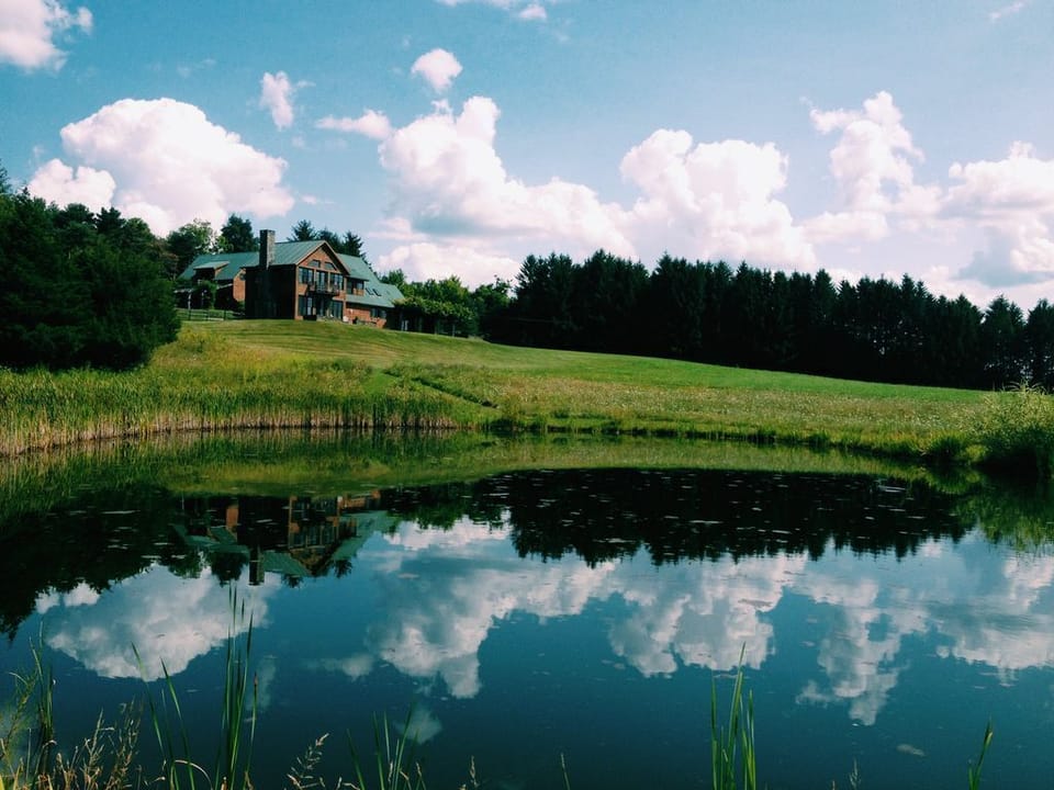 View of the house from trail around the pond