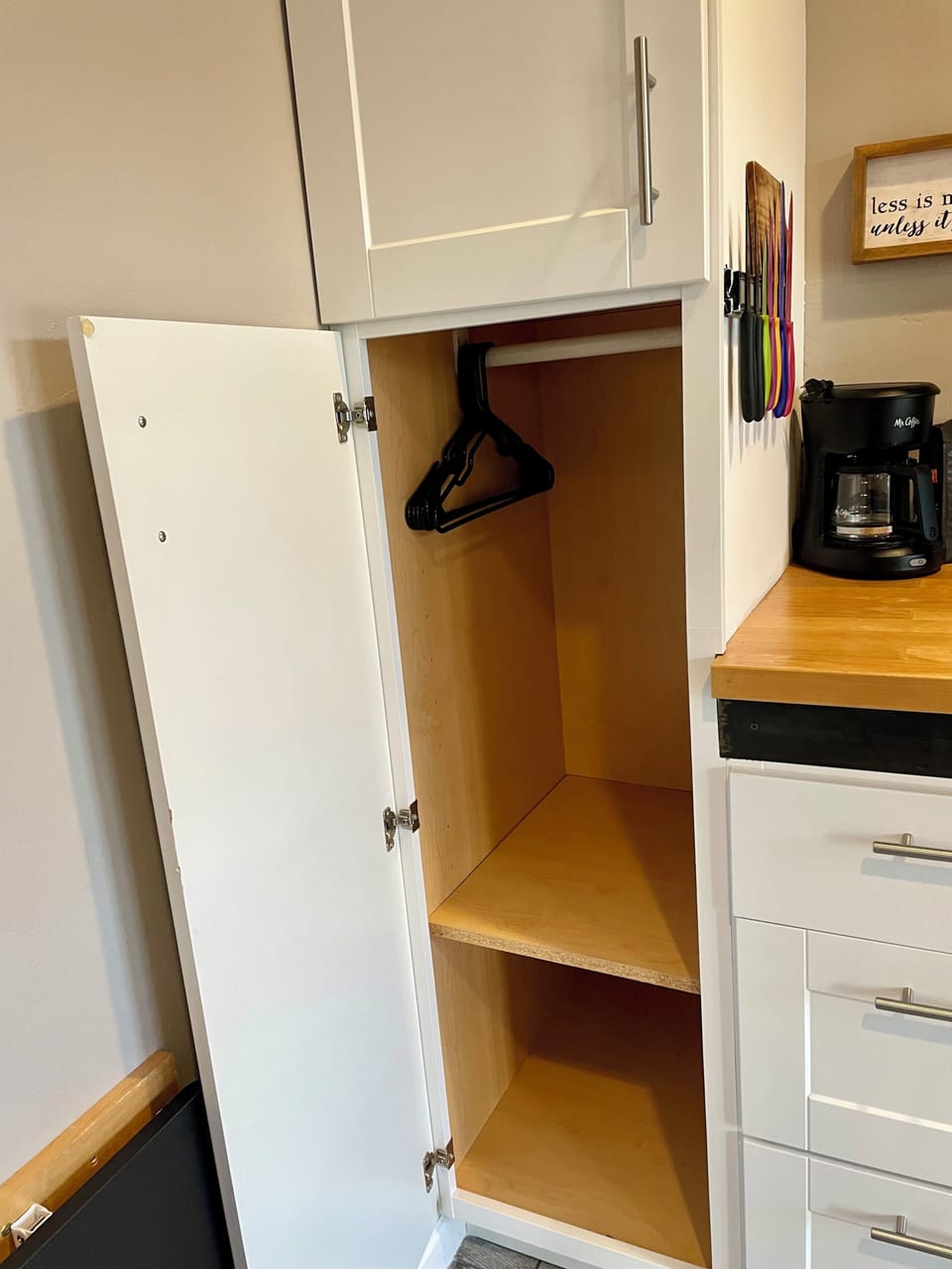 Tall storage closet for clothes and shoes. hangers are provded
