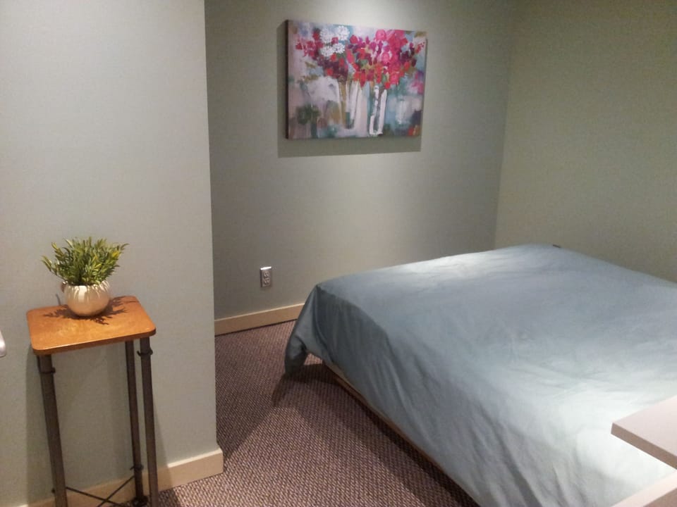 Bedroom is spacious with a comfy queen bed
