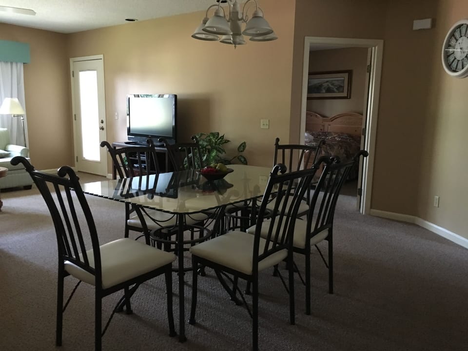 Dining table seats six, breakfast bar seats 3.
