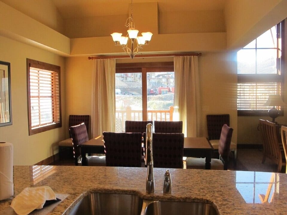 2 dining areas both with table and chairs and counter seating