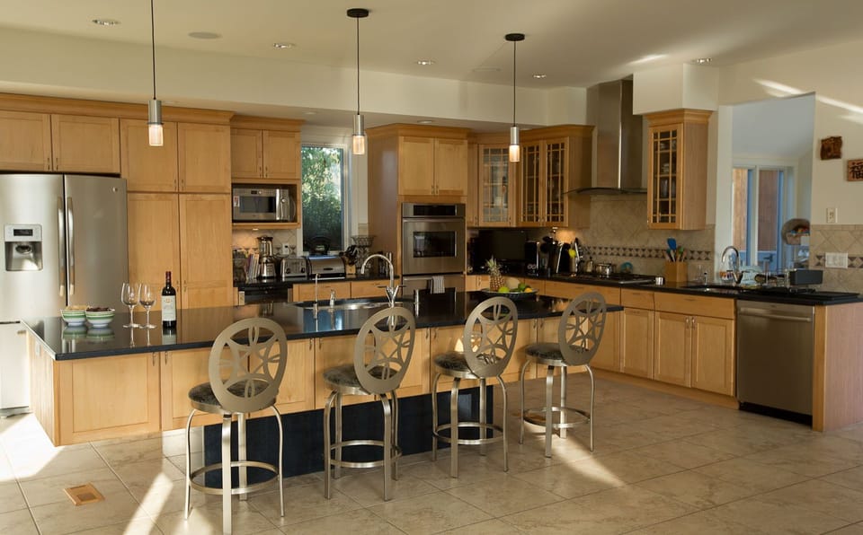 open state of the art kitchen adjacent to dining and living room
